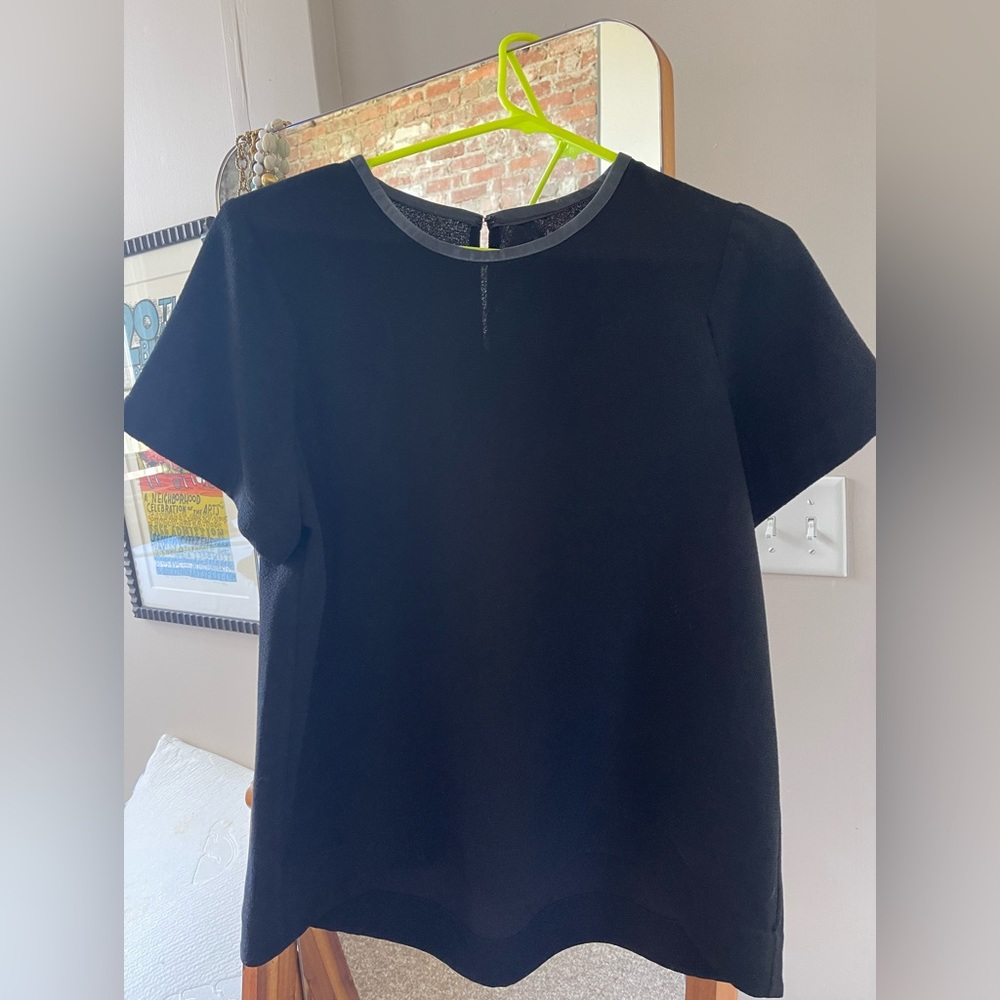 Madewell L black shirt sleeve blouse with leather piping around the collar